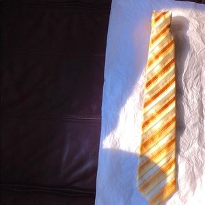 Neck tie Boss brand in stripes of gold and yellow